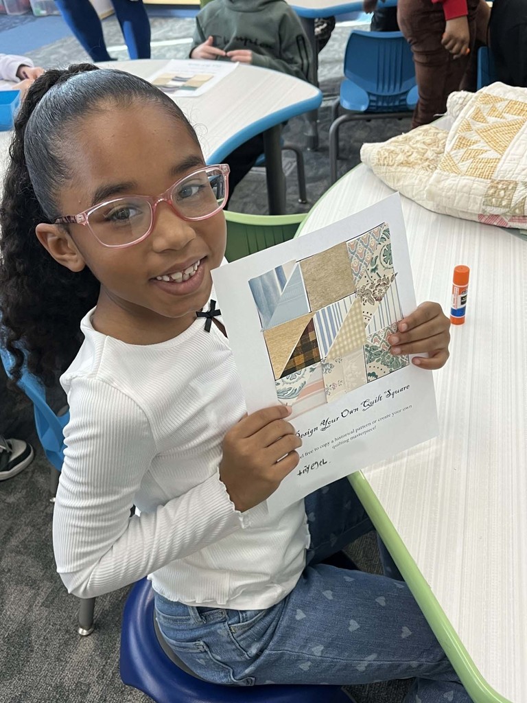 student shows off her creation