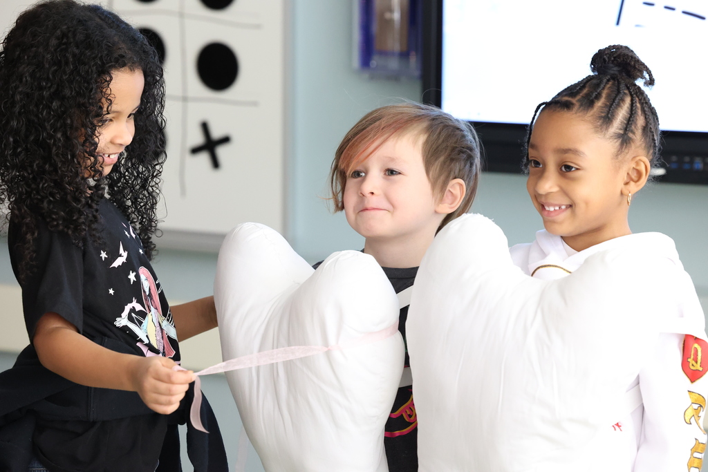 Students dress up as fake teeth that are flossed