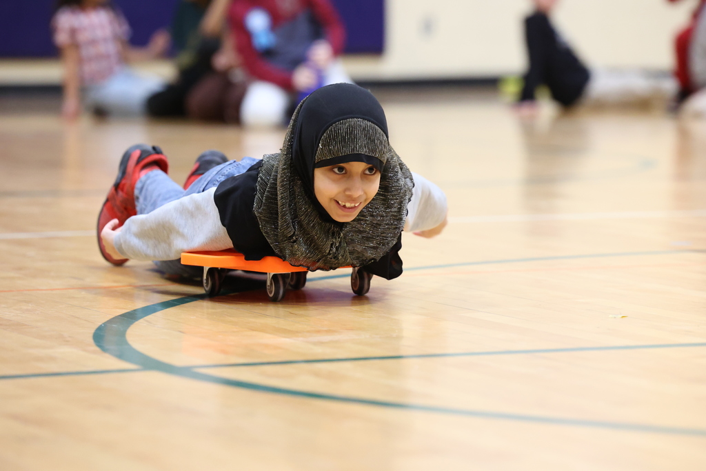 student lay on top of scooter