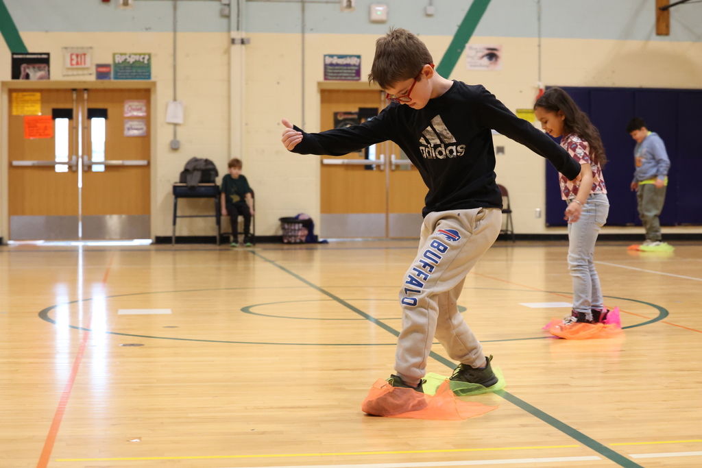 students scoot on scarves