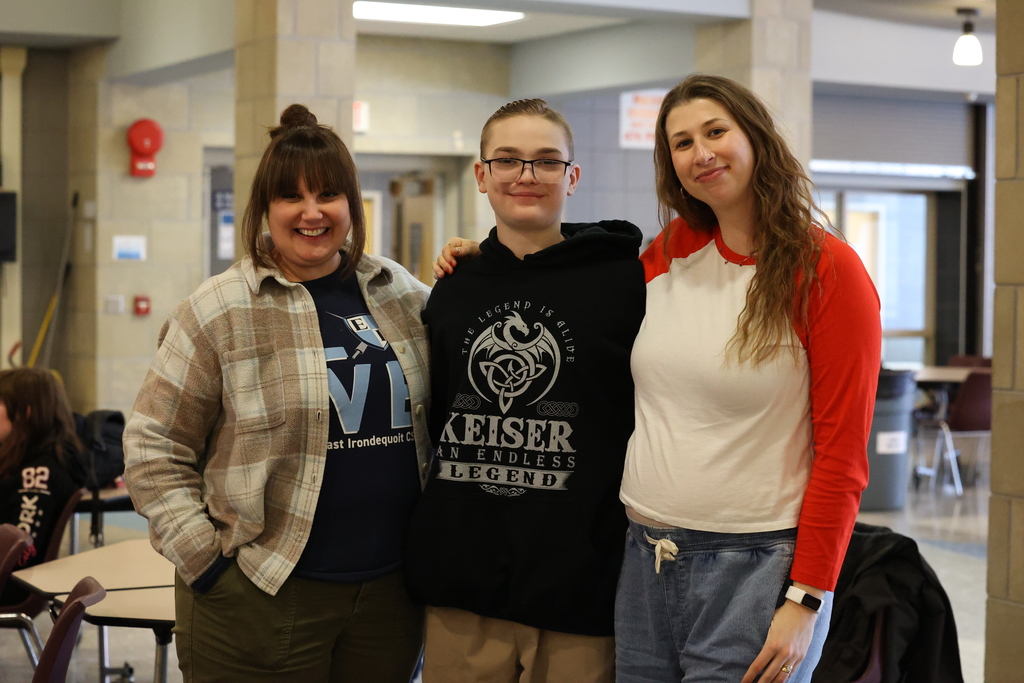 student and teachers pose for a picture