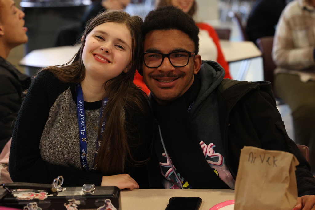 stduents pose and smile for a picture