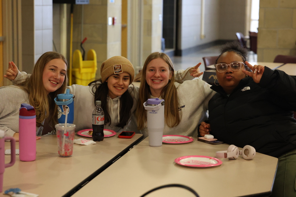 Students pose for a photo in the cafeteria