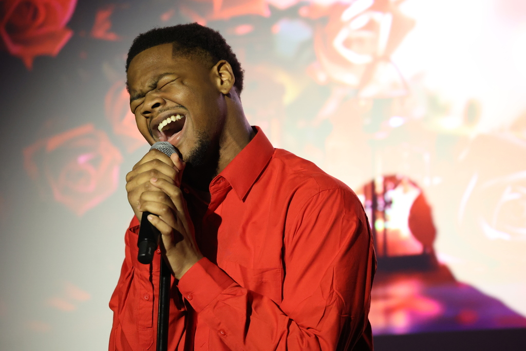 student sings into the microphone
