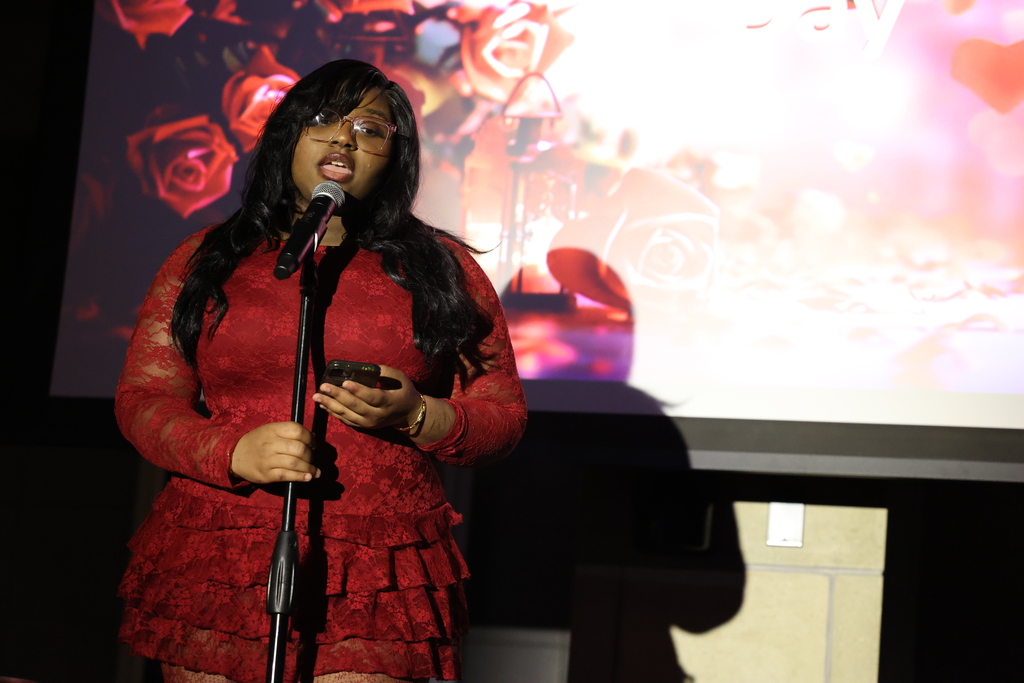 student sings into the microphone