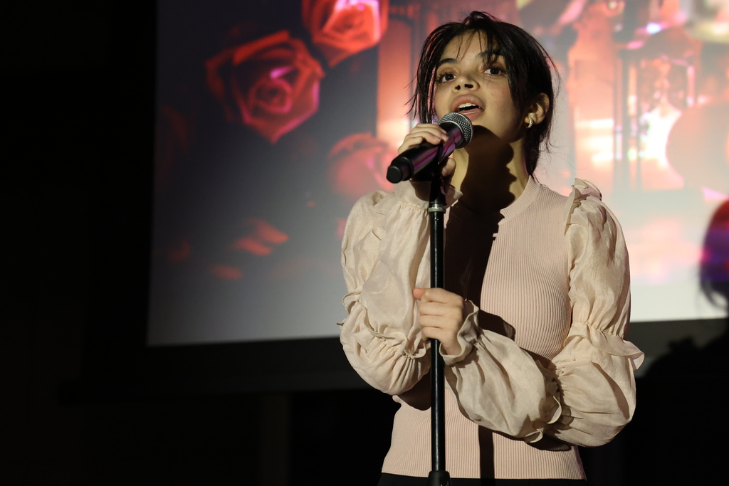 student sings into the microphone