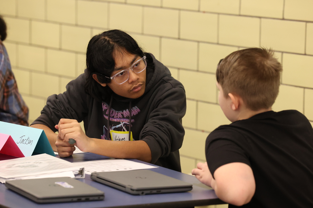 student listens to another