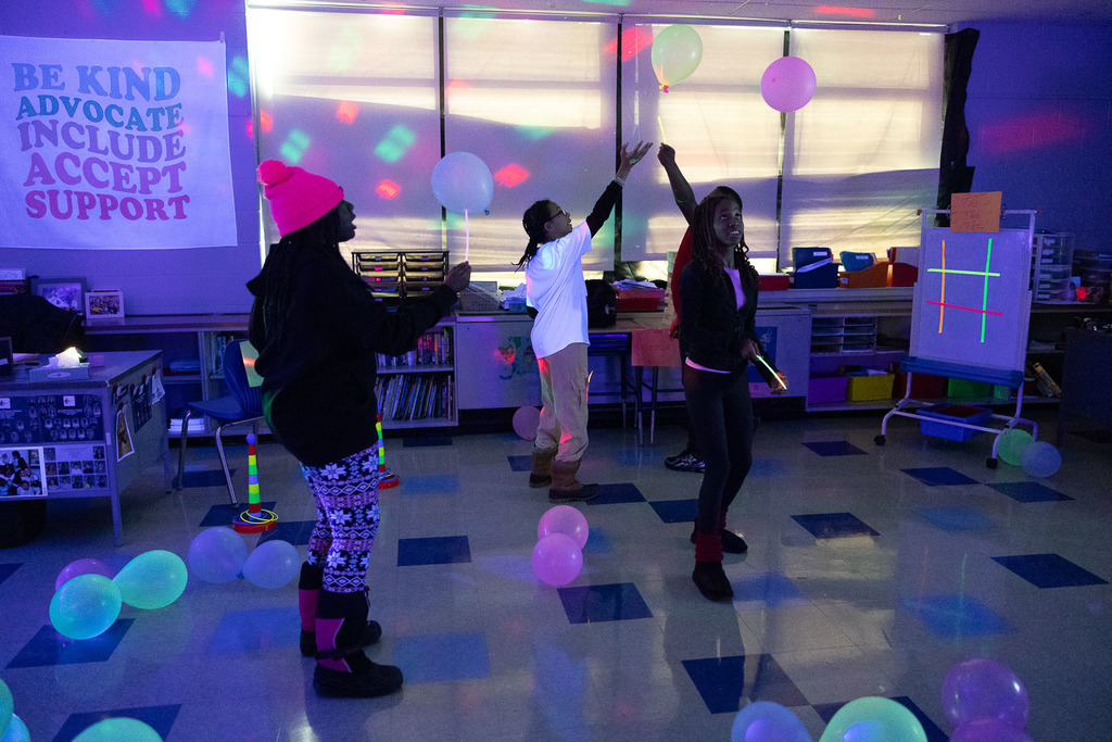5th graders playing games in the dark at their glow party
