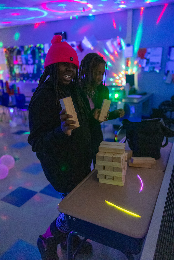 5th graders playing games in the dark at their glow party