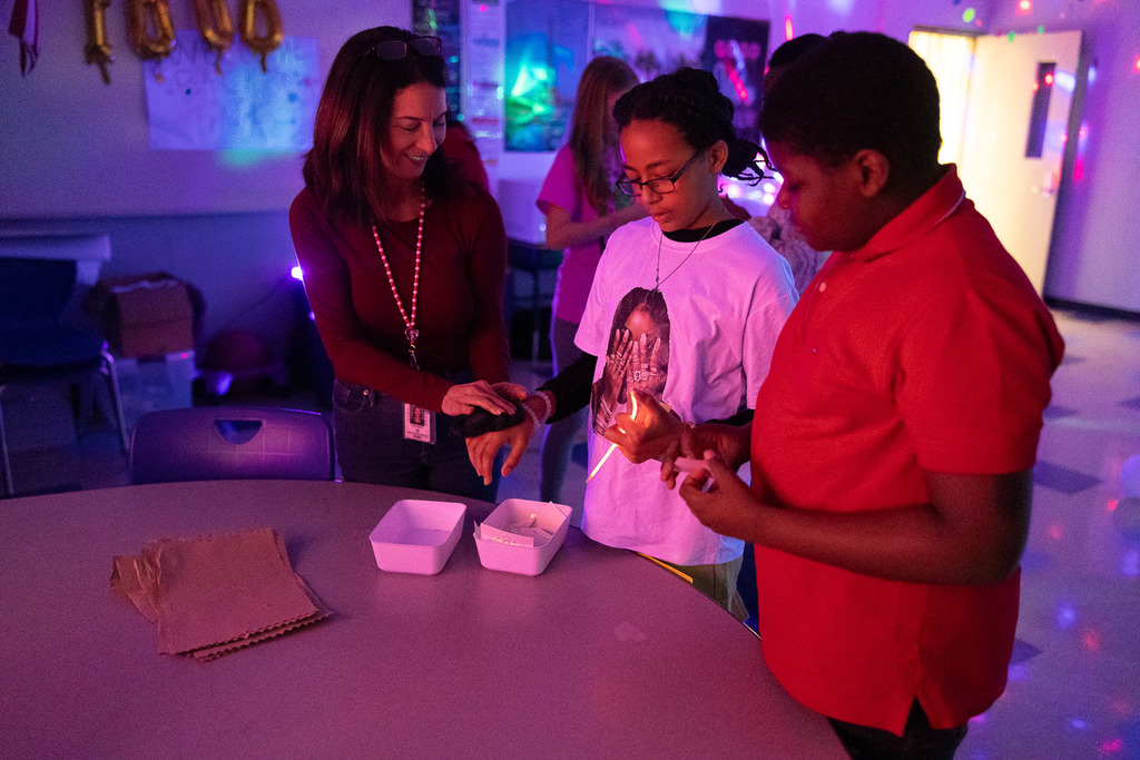5th graders playing games in the dark at their glow party