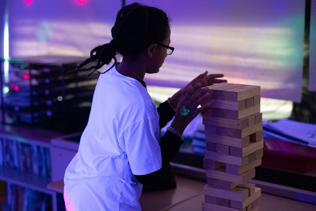 5th graders playing games in the dark at their glow party
