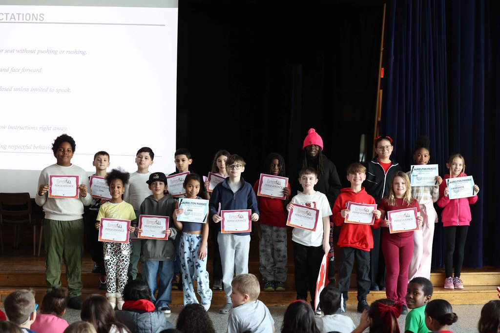 Group of students hold their certificates