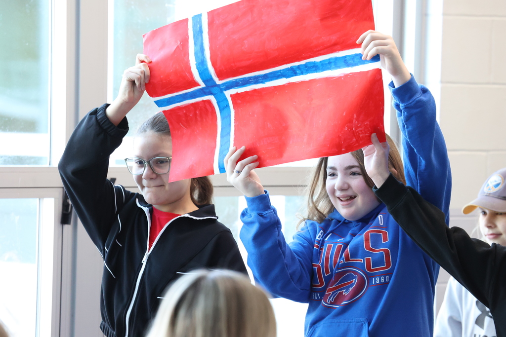 Students hold up flag from Norway