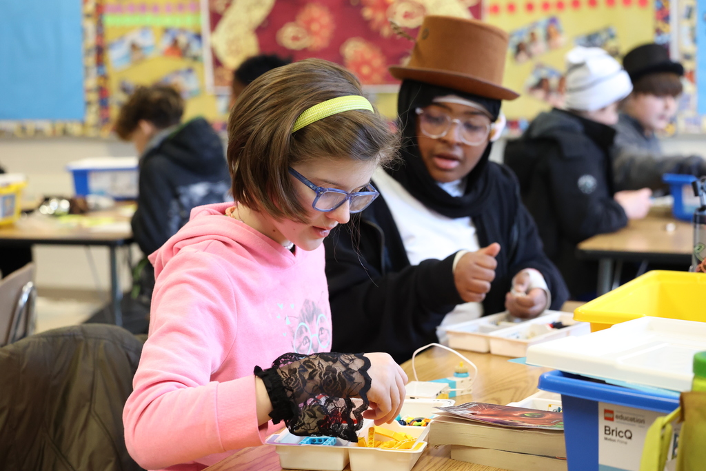 students work on legos