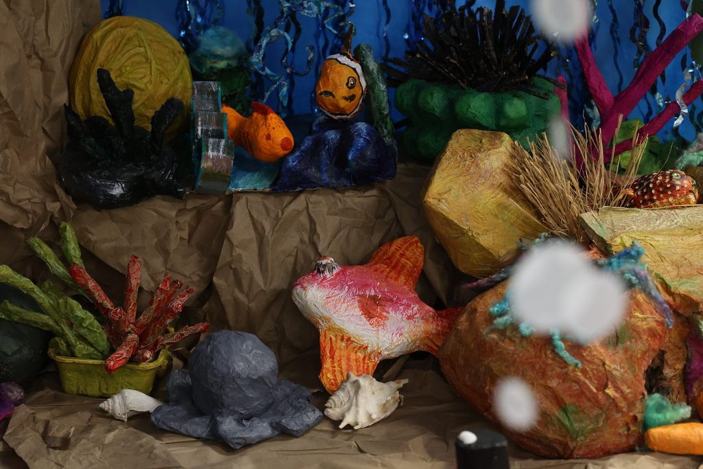 fishes and coral in underwater art display