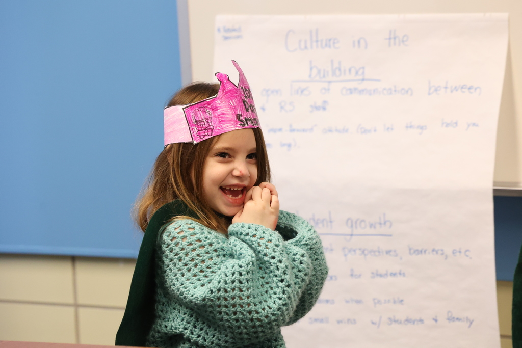 Student smiles with crown