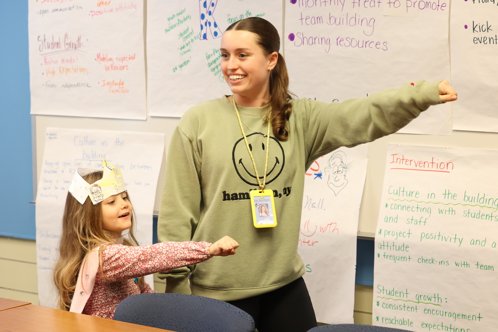 teacher and teacher strike superhero pose