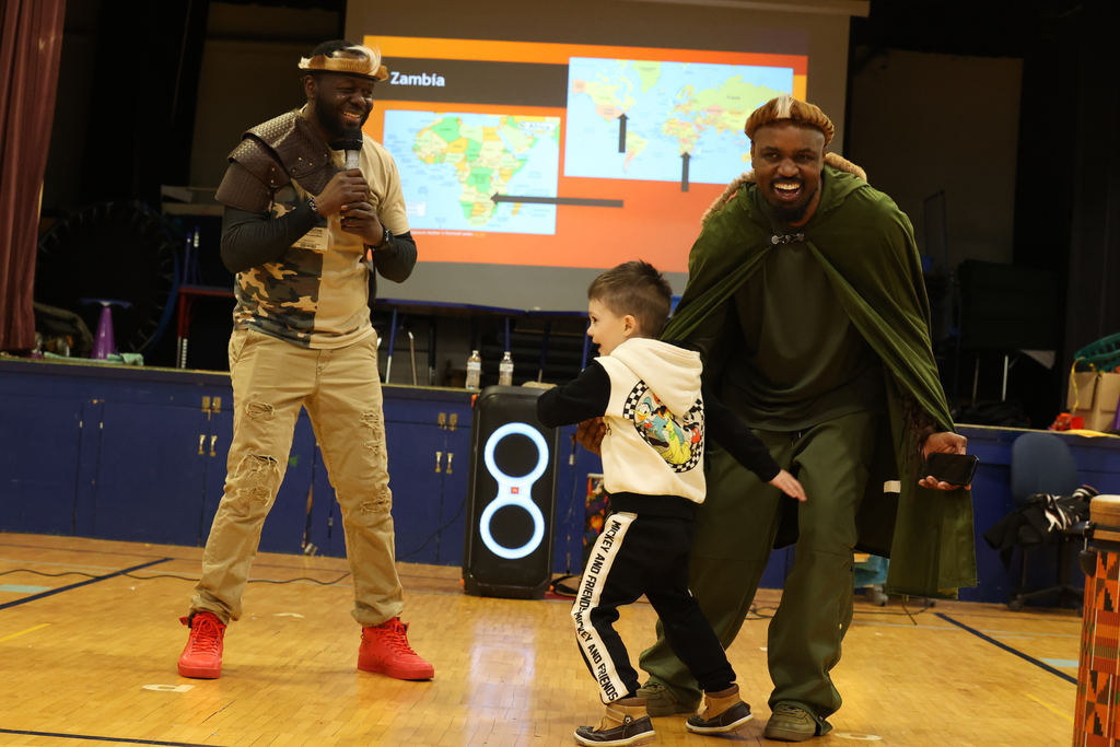 student dances with performers
