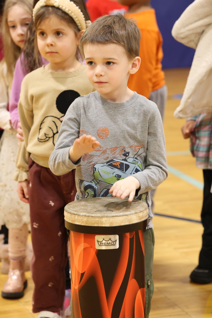 student plays the drums