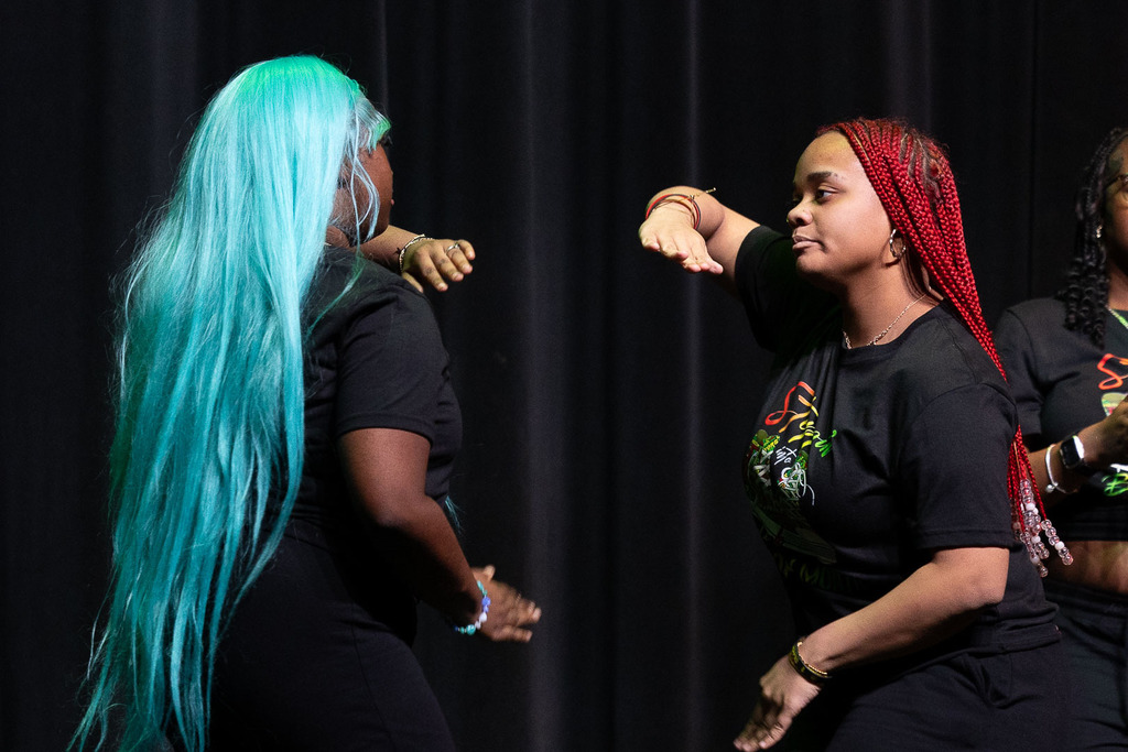 Students giving presentations and performances during the black history month celebration