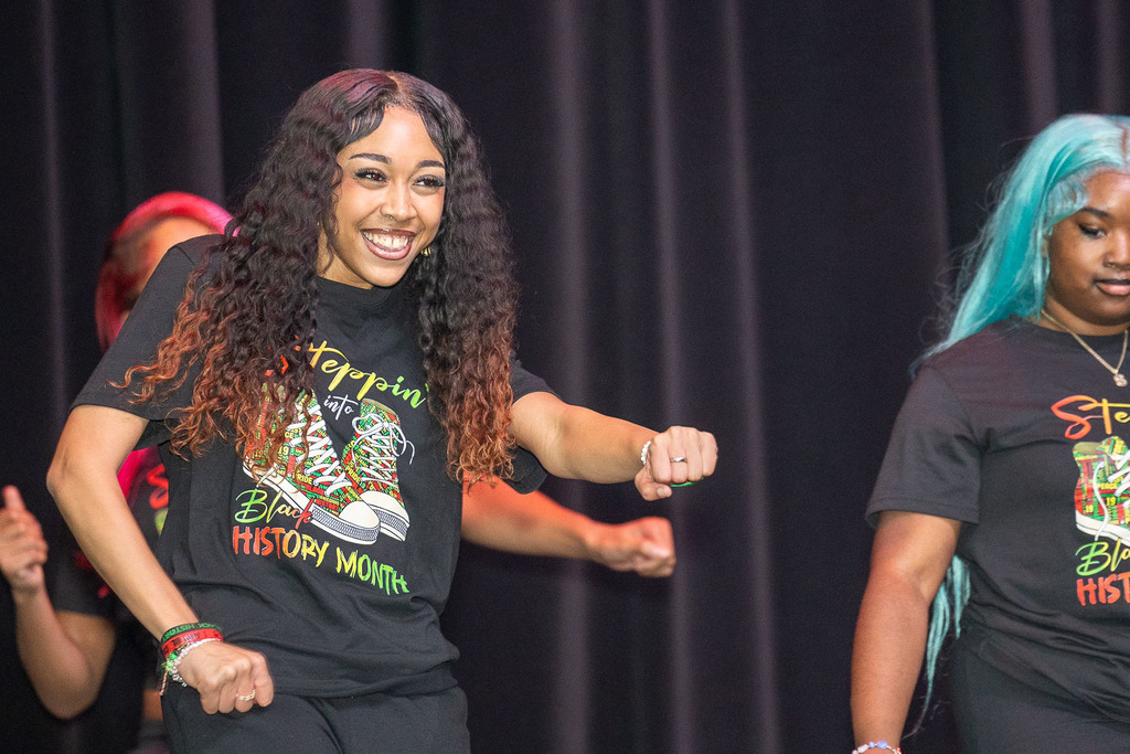 Students giving presentations and performances during the black history month celebration