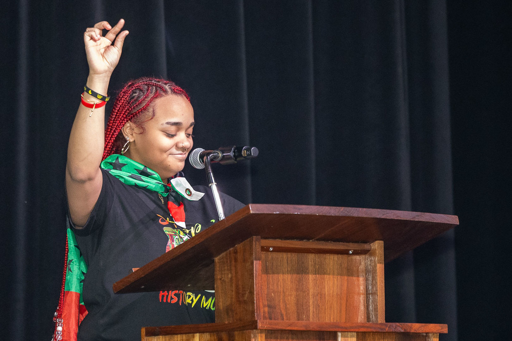 Students giving presentations and performances during the black history month celebration