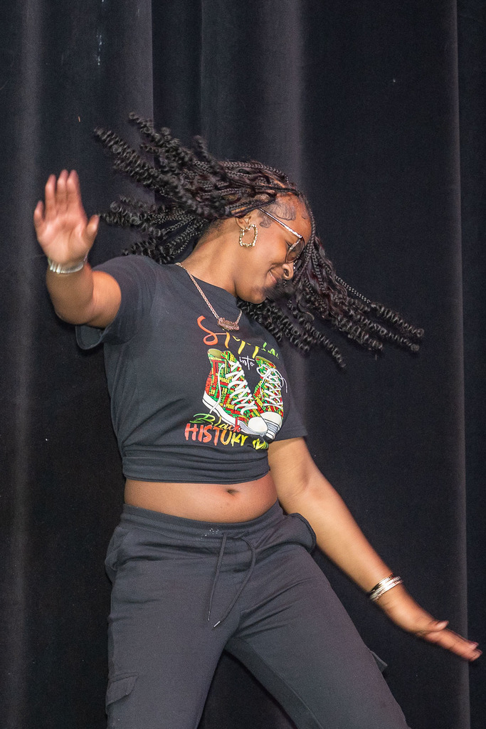 Students giving presentations and performances during the black history month celebration