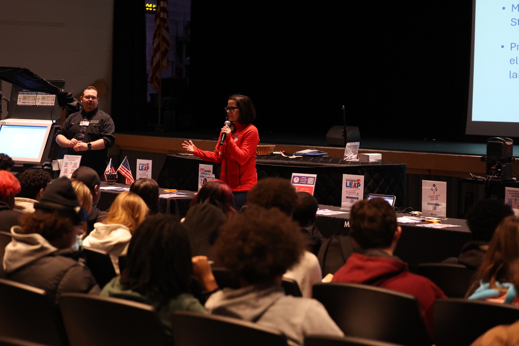visitors talk to students about voting