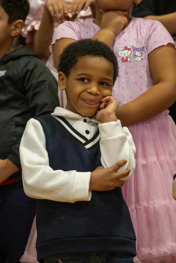 students singing and dancing at their concert