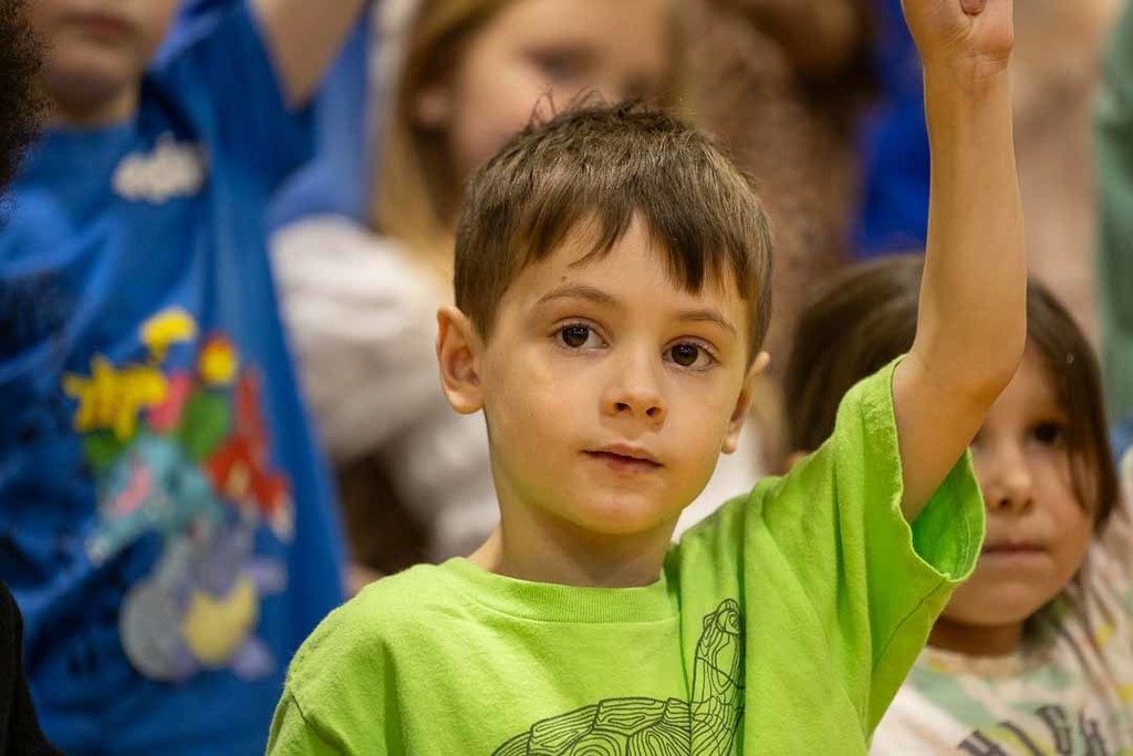 students singing and dancing at their concert