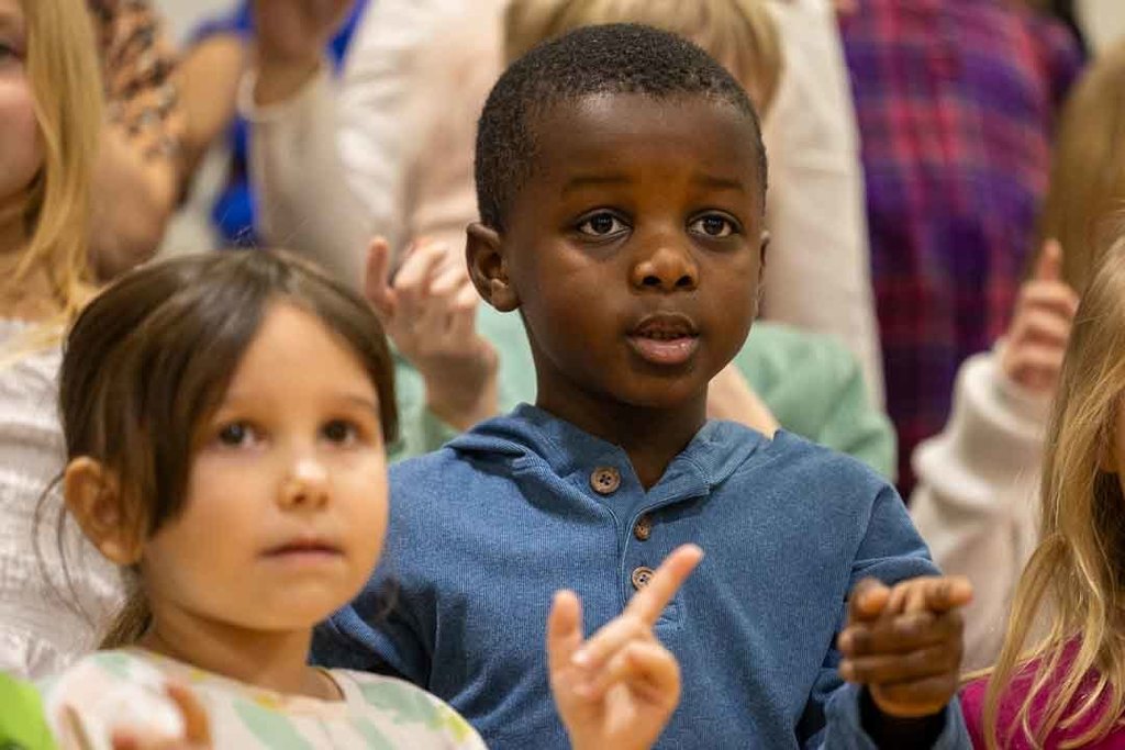 students singing and dancing at their concert