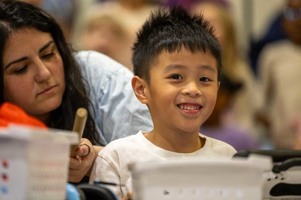 students singing and dancing at their concert