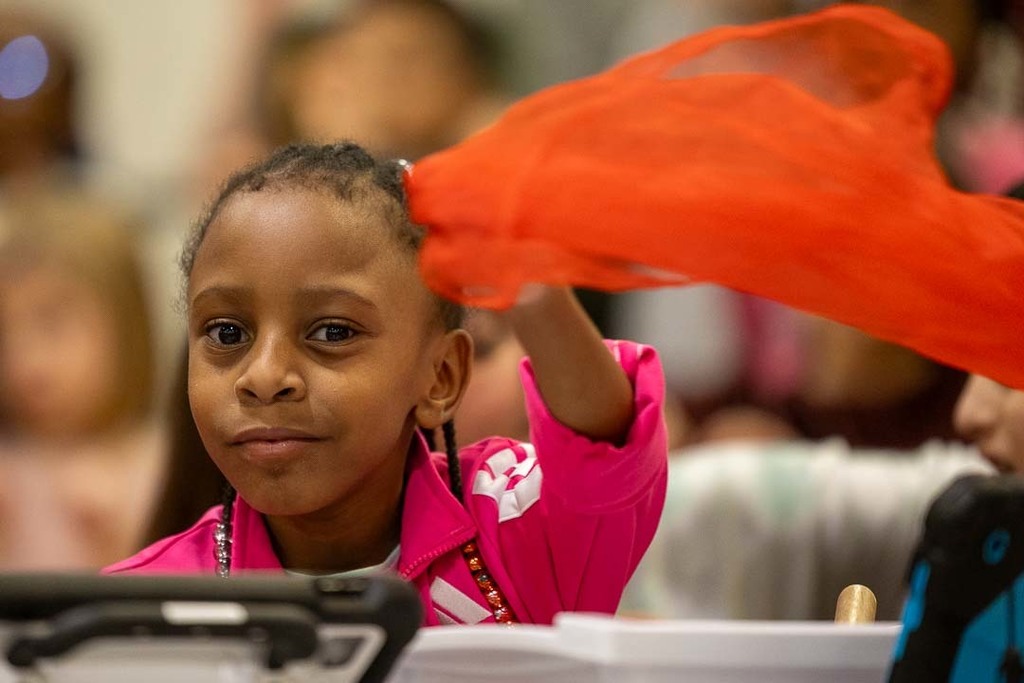 students singing and dancing at their concert