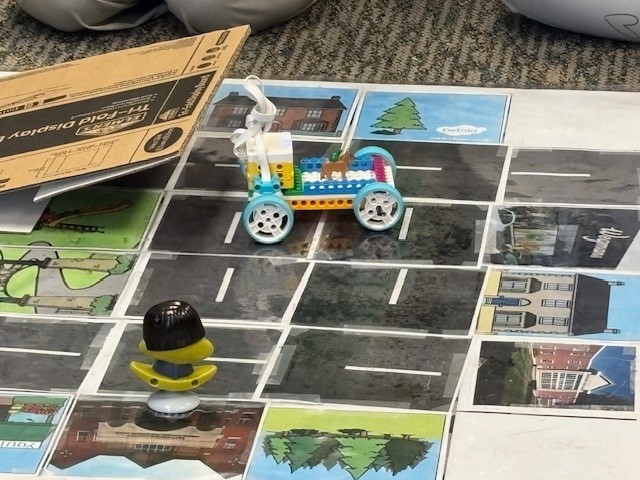 Students presenting their robots and obstacle courses