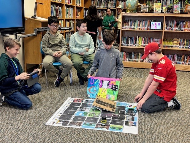 Students presenting their robots and obstacle courses
