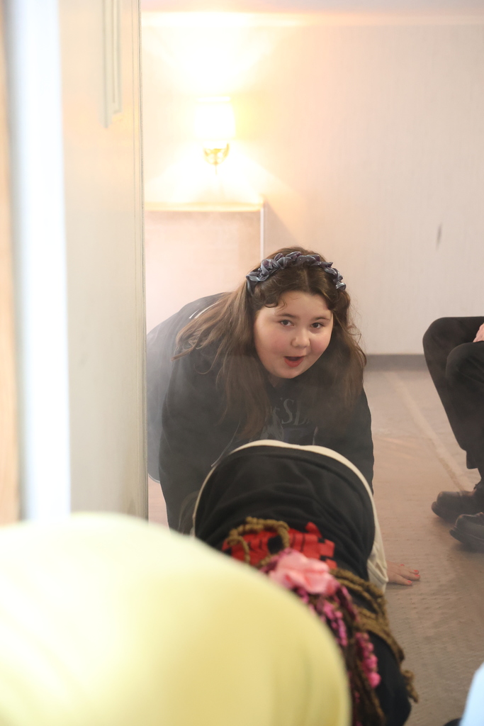 student practices crawling 