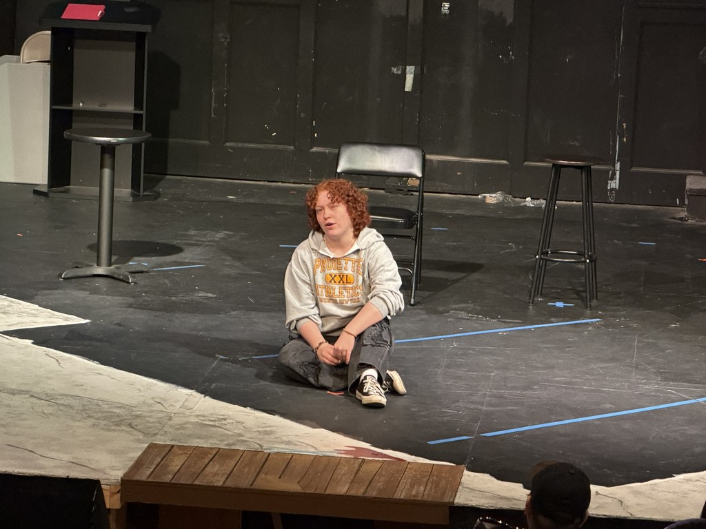 student sings on stage 