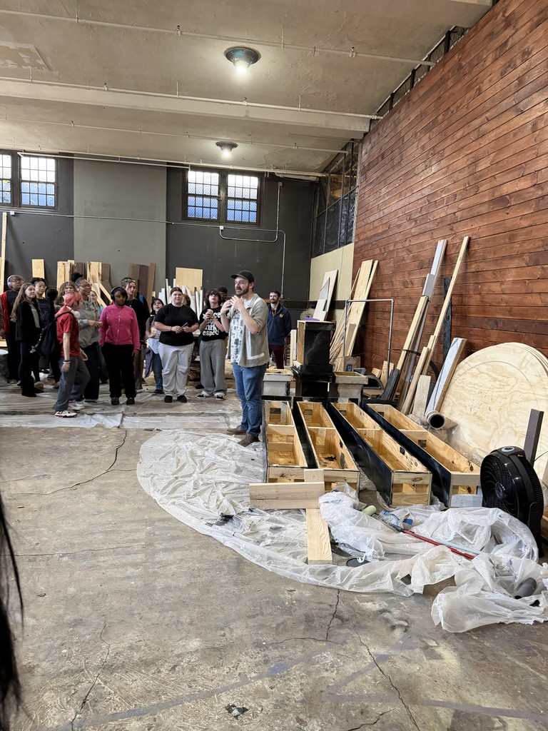 Staff talk to the students about stage and prop building