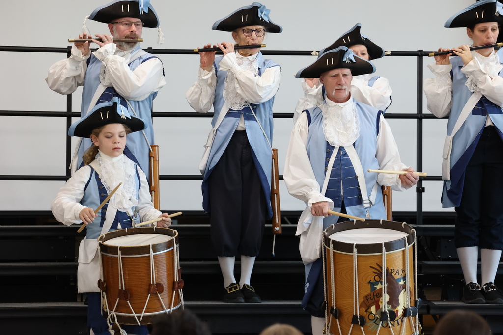 LP student plays the drums with other members of the Towpath Volunteers Fife & Drum Corps