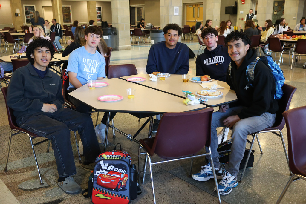 table of students gathers for senior breakfast