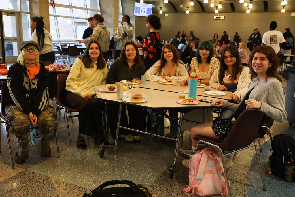 table of students gathers for senior breakfast