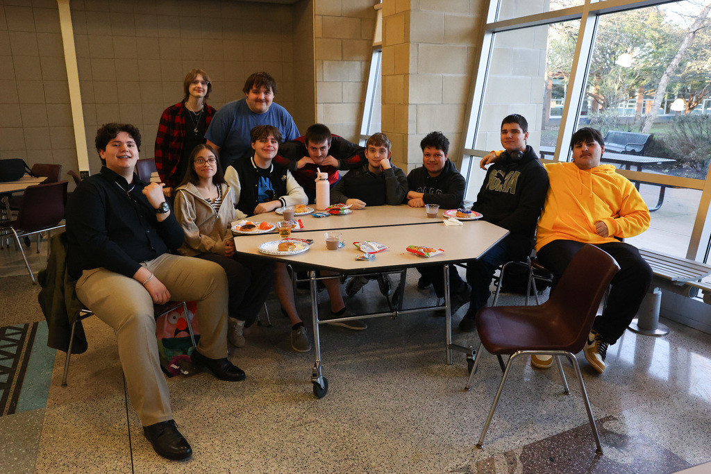 table of student gathers for senior breakfast