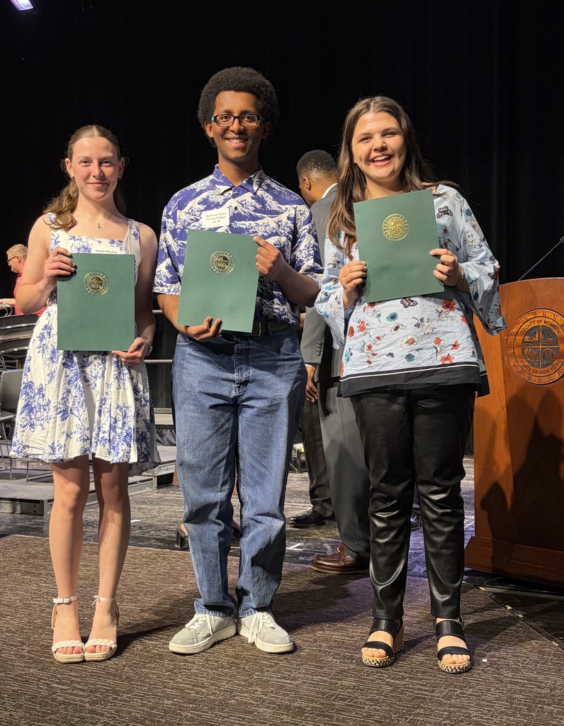 Three EI students hold up awards