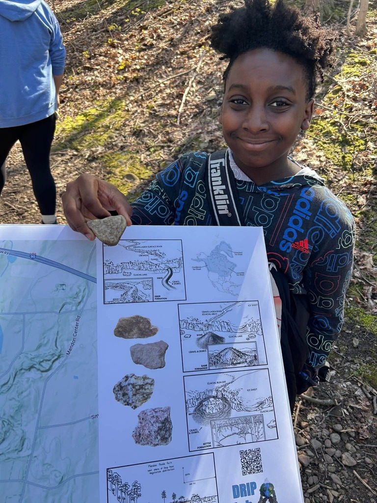 students shows rock that was found of the map