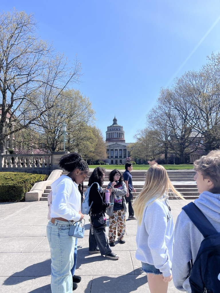 students walk outside during U of R campus tour