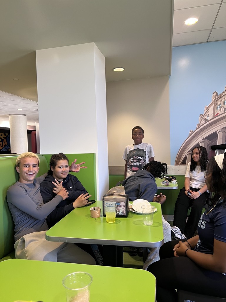 students sit in the dining hall at university of rochester