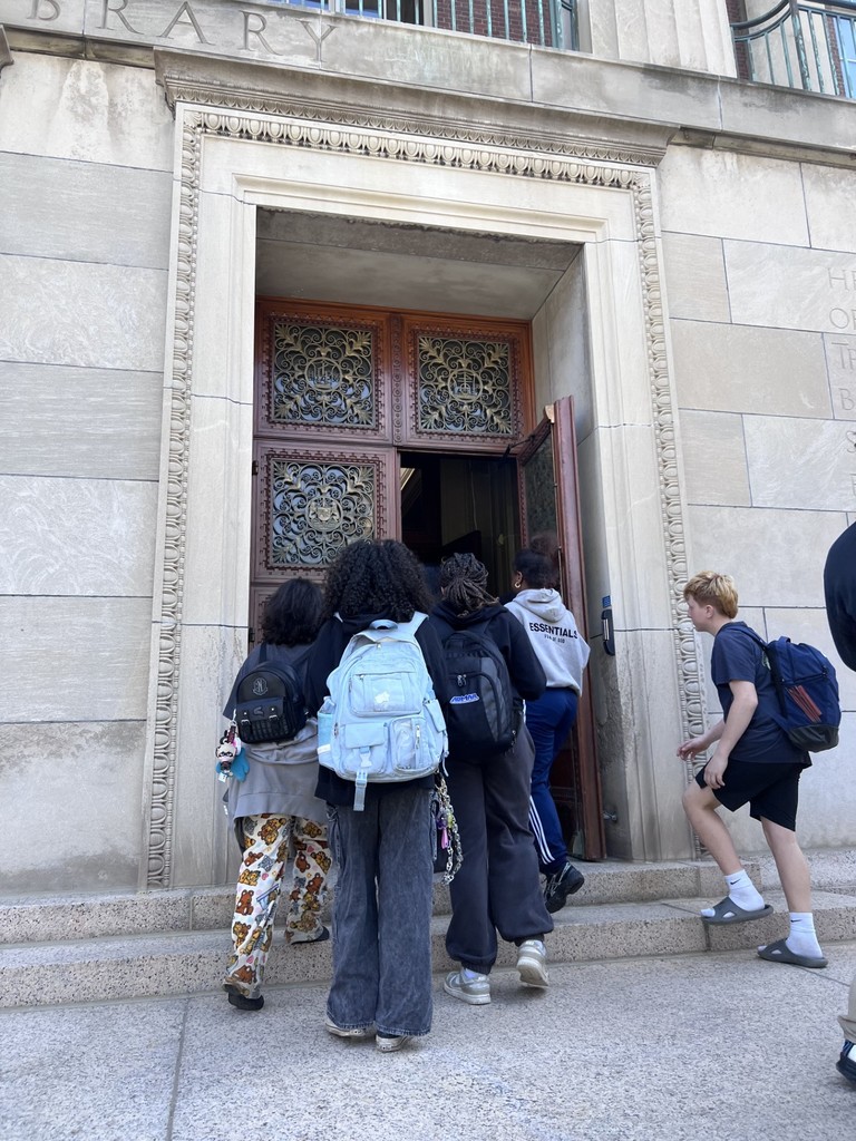 Students walk into door during U of R campus tour