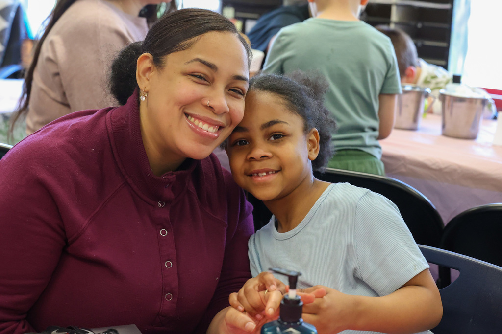 Student pose with mom and smiles