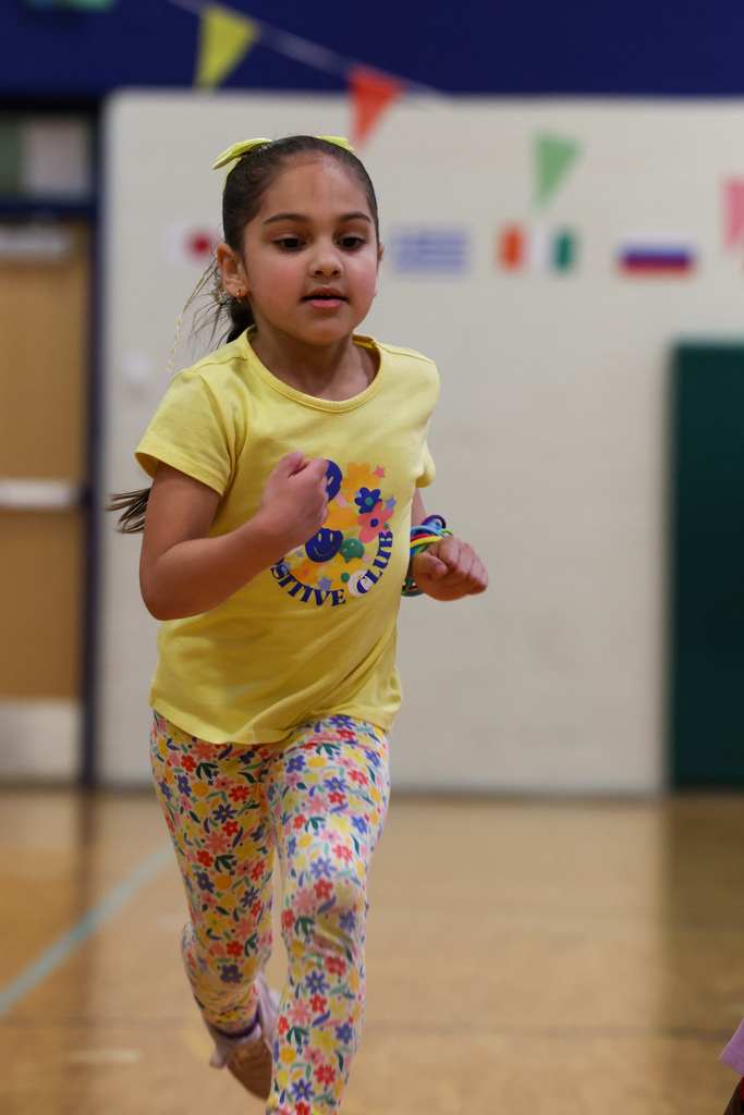 students runs and has fun during gym class