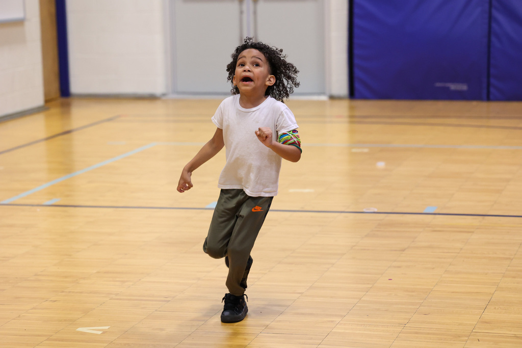 students runs and has fun during gym class